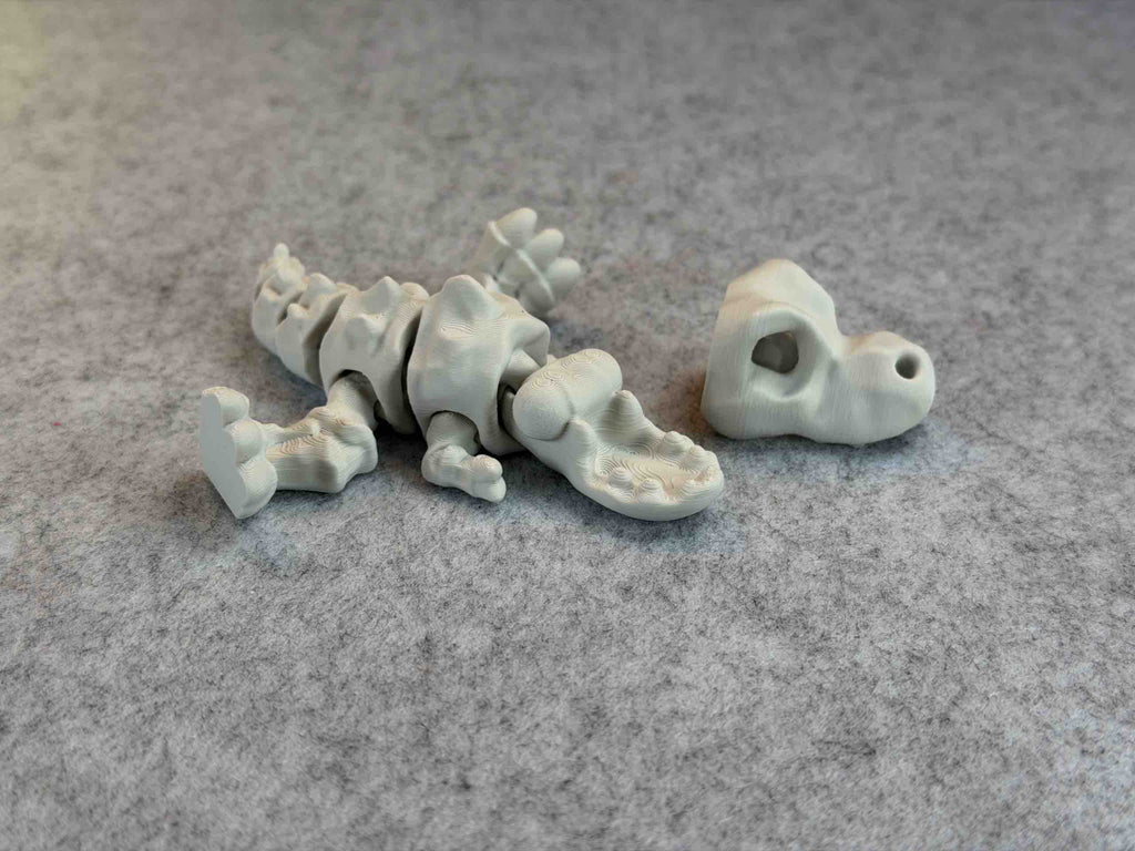 White 3d printed T REX articulated