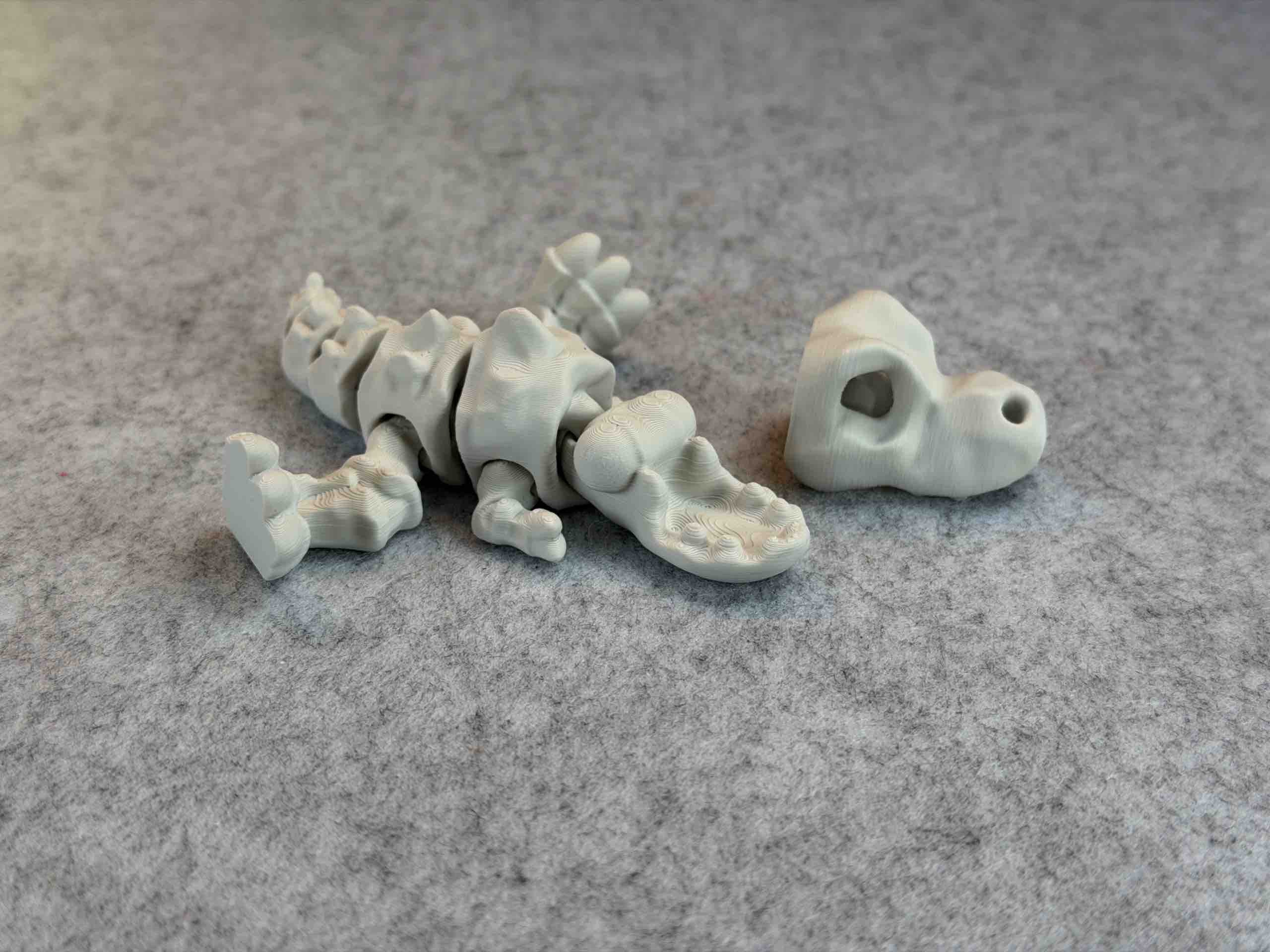 White 3d printed T REX articulated